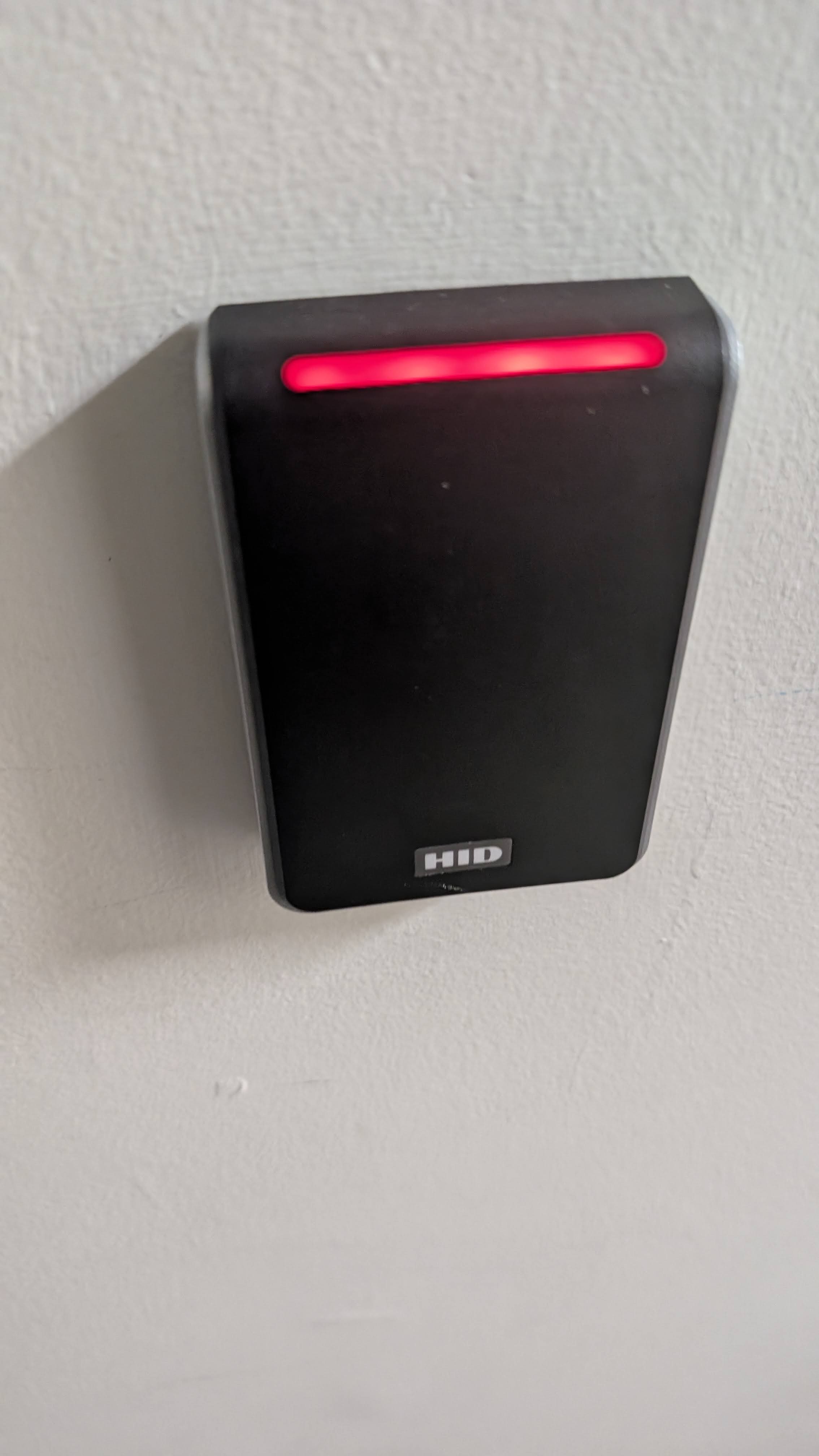 The sound of the keycard readers at school.